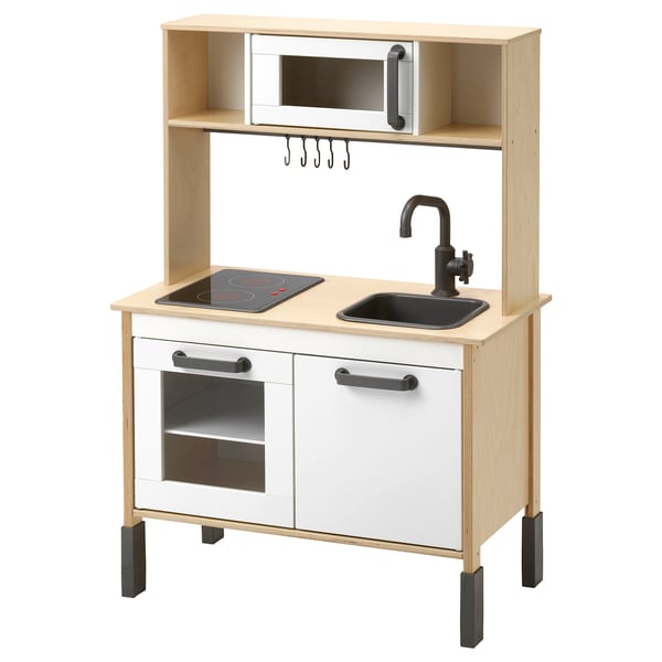 DUKTIG kids wooden kitchen, white and natural wood, with stove, sink, microwave, and storage.