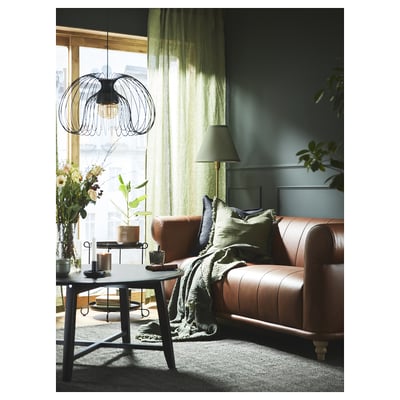 Two green-grey linen curtains with rod pockets, offering privacy and light filtering.