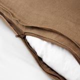 Hidden zipper on linen cushion cover, easy to remove for washing.