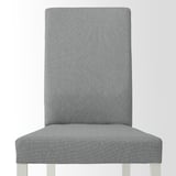 Highback grey fabric dining chair with solid legs.