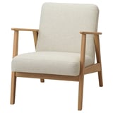 Mid-century chair: light gray fabric, light wood frame, square shape, armrests.