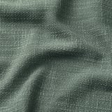 Tactile, textured fabric with subtle color variations, likely a sofa or chair cover.