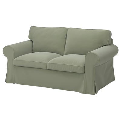 Green EKTORP sofa, smooth fabric, rolled arms, back cushions.