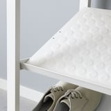 White shoe shelf holds multiple pairs, ideal for wardrobe organization. Angled design for easy access, part of the ELVARLI system.