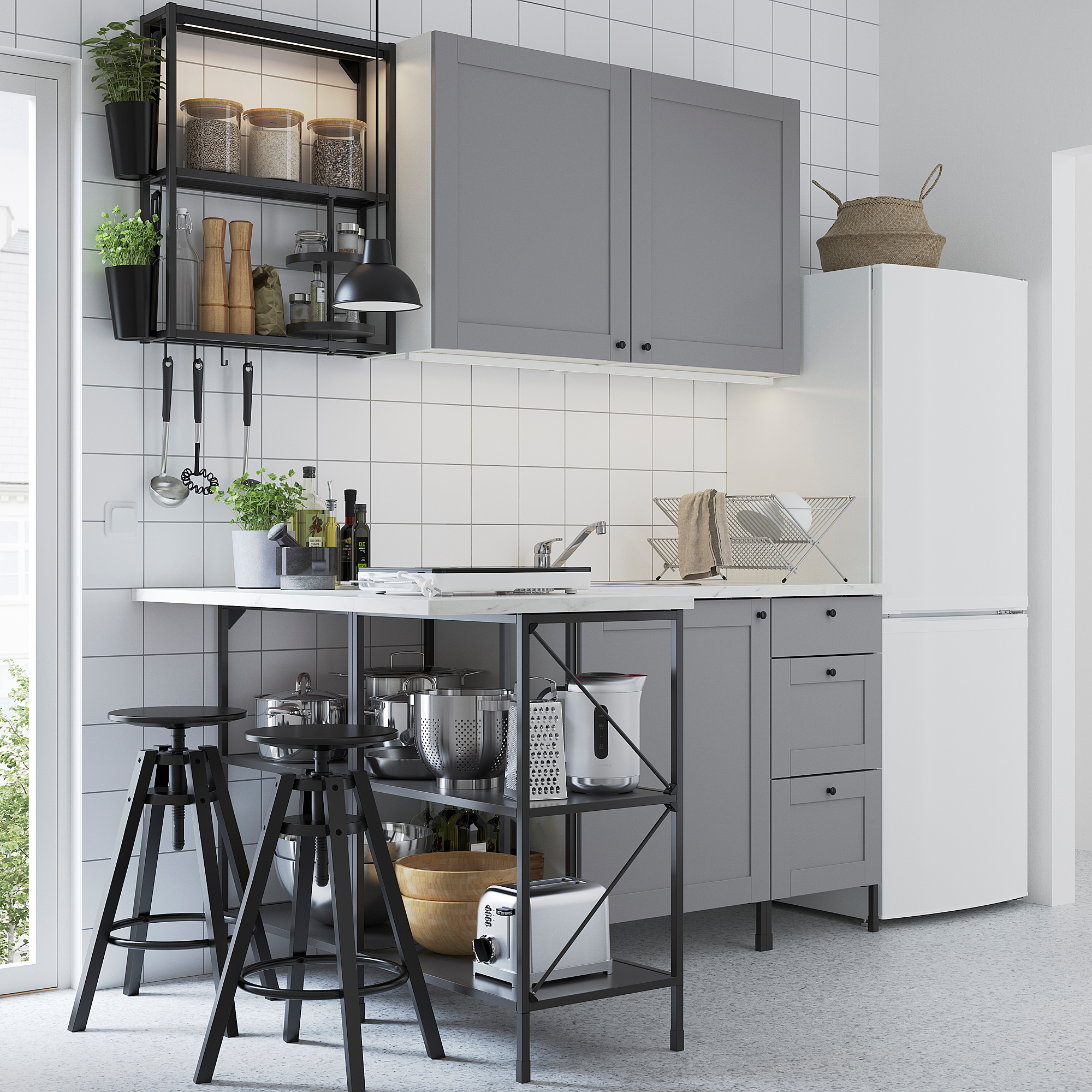 Modern kitchen with ENHET series: grey cabinets, black metal stools, white countertop, stainless steel appliances, hanging shelves, tiled backsplash.