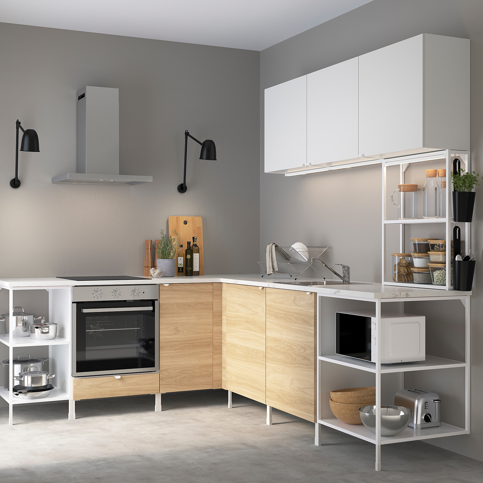 ENHET kitchen in light wood and white. Modern minimalist design, corner setup with oven, counter appliances, and open shelves for storage.