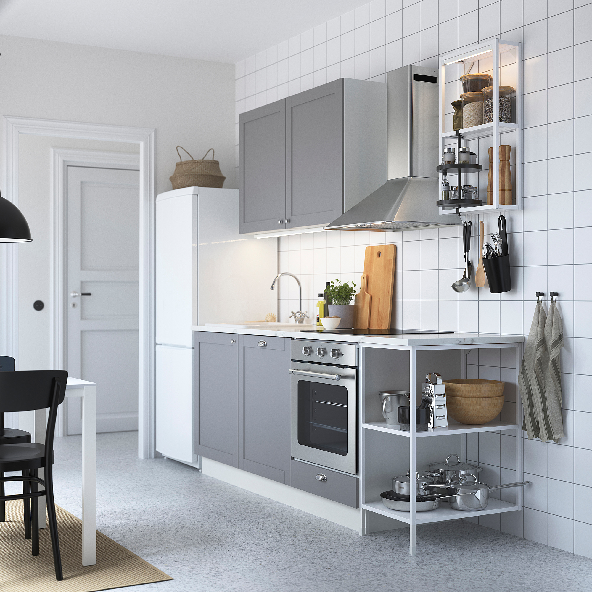 Modern gray kitchen with white tile backsplash, stainless steel appliances, hanging utensils, and a single bowl ceramic sink.
