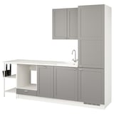 Modern kitchen setup in grey. Cabinets, sink, and countertop. Minimalist design.
