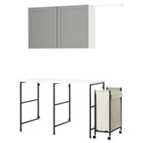 The ENHET laundry set, featuring a grey wall cabinet, a black metal foldable table, and a beige laundry bag on wheels.