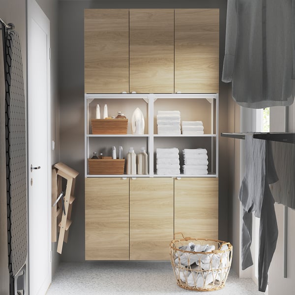 Modern bathroom cabinet: ENHET with light wood doors, open shelves, gray curtains. Size: tall, fits between door & window.
