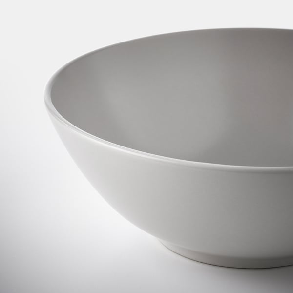 White glossy bowl on light surface.