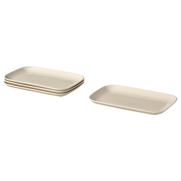 Four beige rectangular ceramic plates, two stacked and two alone, with smooth edges and a simple design.