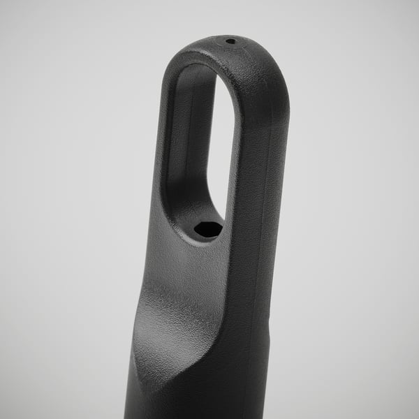Sleek, black plastic kitchen roll holder with ergonomic loop for easy carrying.