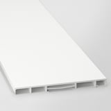 A close-up of a modern white cabinet plinth, showing sleek surface and support brackets.
