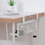 Wooden desk with white FÖRSÄSONG cable tray, holding laptop, pen, and plant. Cable tray attaches under desk for organized workspace.
