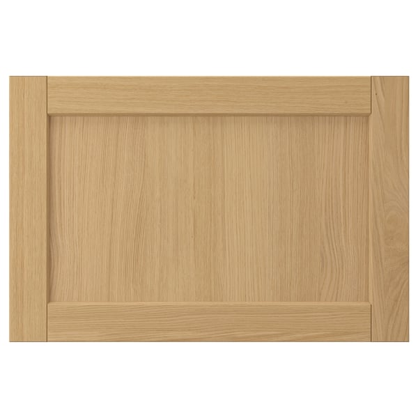 This image shows a FORSBACKA wooden cabinet door in natural oak color, featuring a rectangular shape with beveled edges and a classic design.