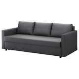 Gray FRIHETEN convertible sofa with cushions and storage.