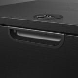 Black wooden desk drawer with sleek handle and digital display, showing quality design and craftsmanship.