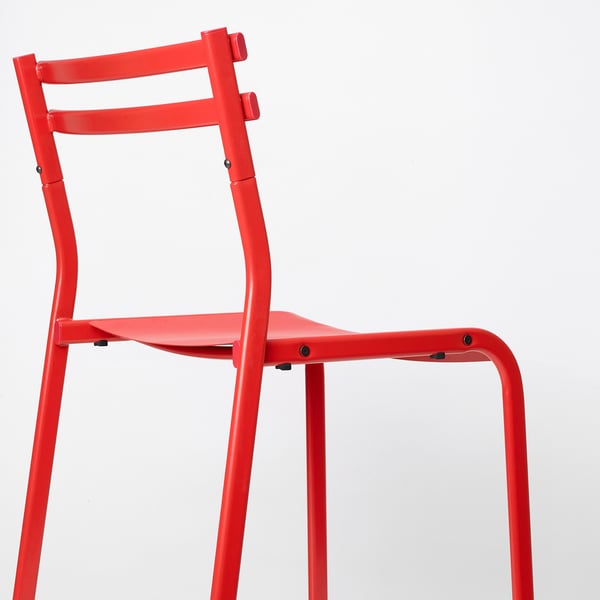 Bright red durable metal chair with sleek design, sturdy legs, and comfortable seat, ideal for lasting use.