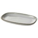 Handcrafted oval stoneware plate with sandy glaze.