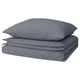 Stacked gray cotton duvet covers with zipper closure.