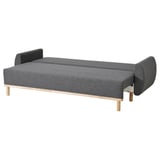 Modern gray convertible sofa-bed with wooden legs, sleek design for space-saving.
