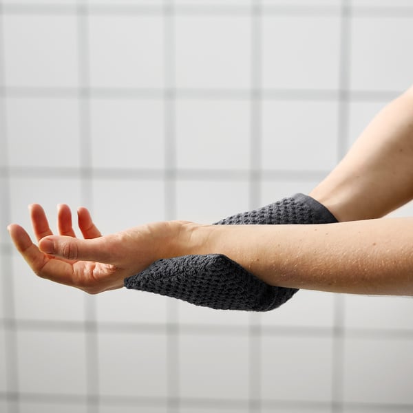 Hand using GULVIAL glove - protective warmth.