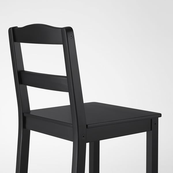 Black wooden chair with clean lines and smooth finish, standing against a plain background.