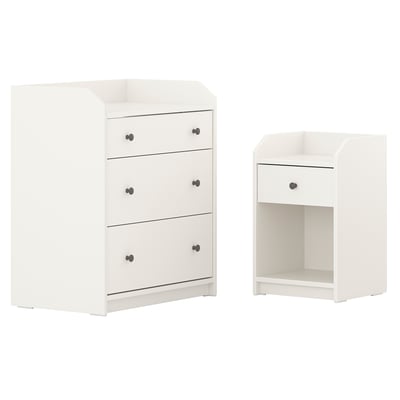A white HAUGA furniture set including a bedside table and a chest of drawers with three drawers and a top shelf.