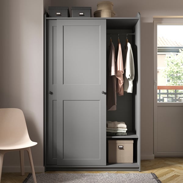 Modern gray HAUGA wardrobe with open and closed storage, hanging garments, shelves, and accessories hooks.