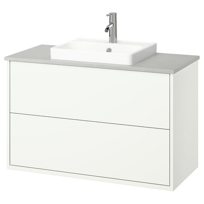 White wall-mounted bathroom vanity with two drawers, square sink, chrome faucet.