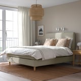 Modern neutral bedroom with HEMFJÄLLET bed, white bedding, wooden nightstand, curtained window.
