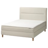 Modern cream divan bed with soft headboard, straight lines, and upholstered sides.