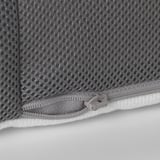 Close-up of a zipper on a grey mesh mattress cover. Quality zipper pull, sturdy stitching, and functional design.