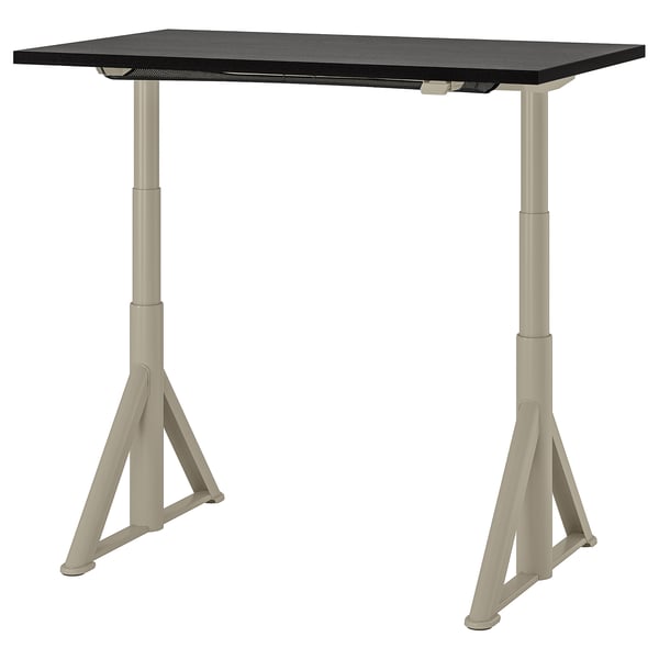 IDÅSEN desk: black top, beige legs. Height adjustable, sturdy, triangular legs.