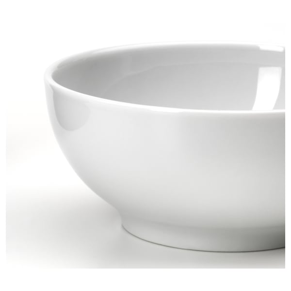 Simple white bowl, smooth surface, clean edges, sturdy design.