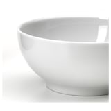 Simple white bowl, smooth surface, clean edges, sturdy design.