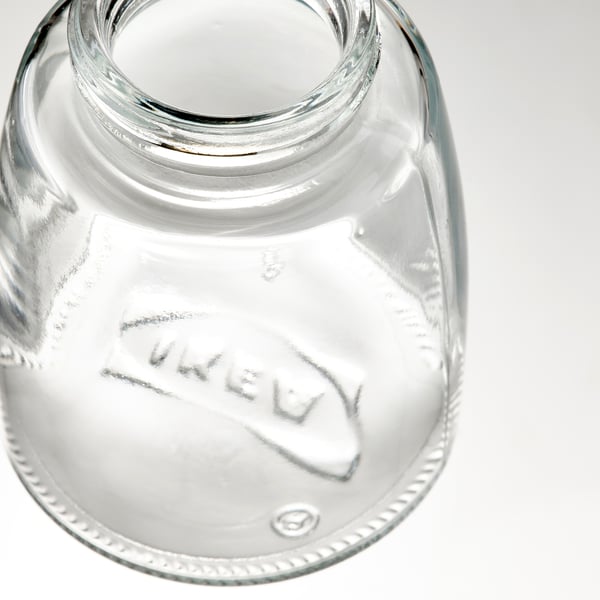 Glass jar with ceramic grinder top, clear and precise, good quality.