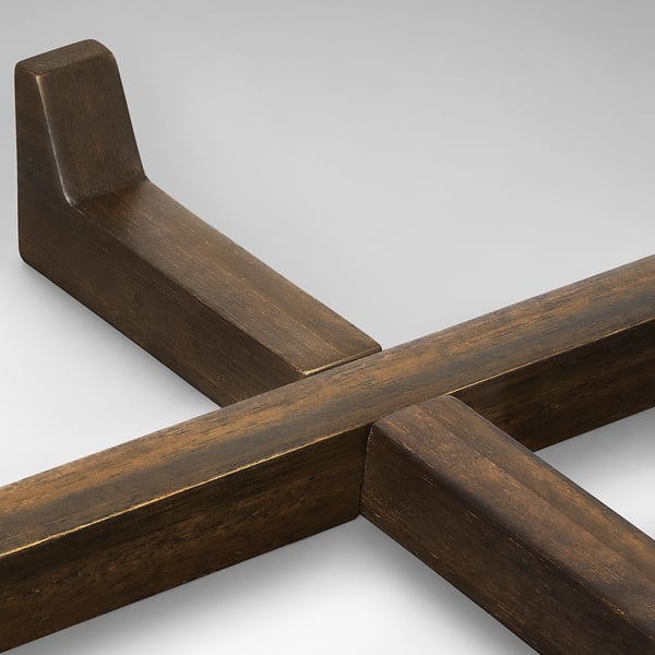 Dark wood serving stand, expertly crafted with smooth finish, showcasing interlocking joints, elegant for dining.