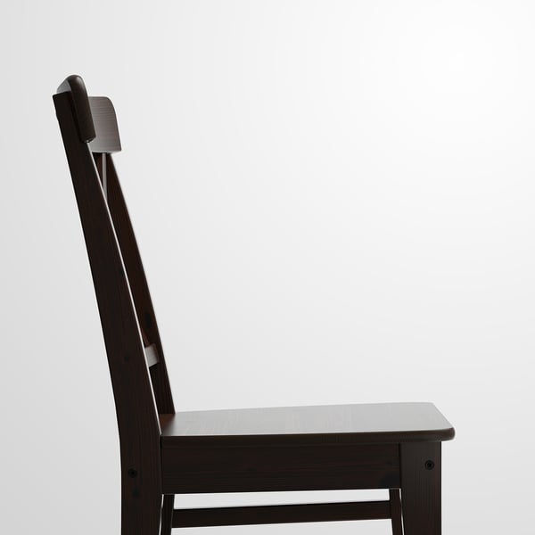 Dark wooden chair with sleek design and high back. Crafted with polished finish, emphasizing durability and comfort.