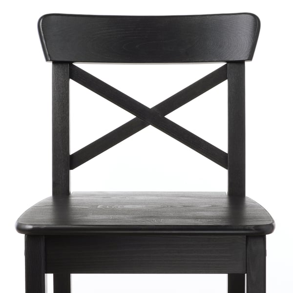 Black wooden chair with x backrest, sturdy, elegant design. Solid pine construction, high-quality finish.