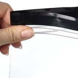 Hand holding an ISTAD bags seal showing its resealable feature.