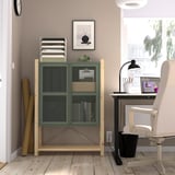 Home office with IVAR cabinet, plants, laptop & window.