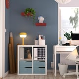 Home office with KALLAX shelf, lamp, desk, plants, sculpture