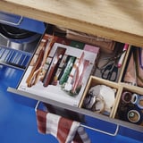 Organized drawer with KÖSSEBÄR resealable bags for food storage and crafts.