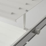 Close-up of sleek, modern metal shoe rack with adjustable shelves and smooth-gliding mechanism.