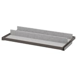 A gray KOMPLEMENT pull-out tray with felt lining for organizing items in a wardrobe.
