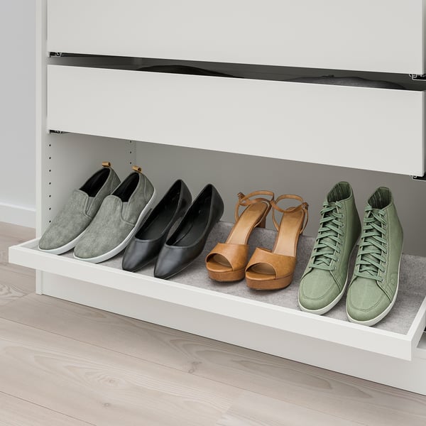 Shoe shelf with pull-out tray, angled for visibility, in modern closet.