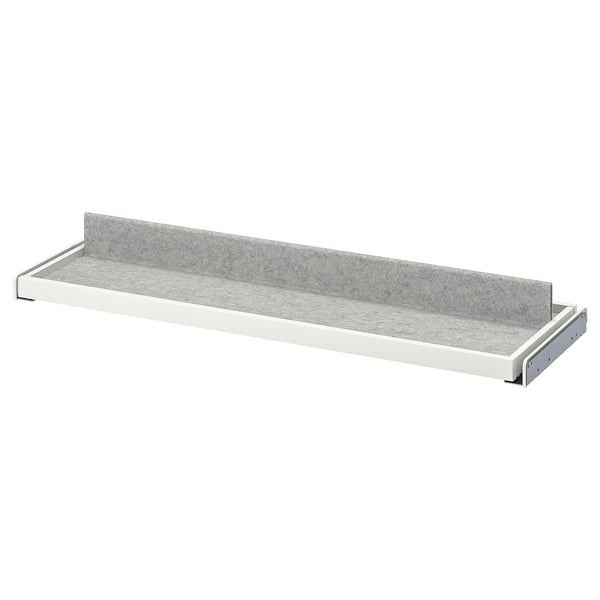 KOMPLEMENT gray pull-out tray, minimalist design, felt lining, water-resistant, white edges.
