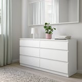 KULLEN chest in bedroom with mirror, lamp, books, plant.